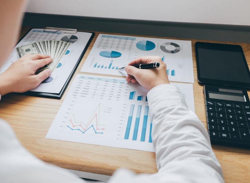 businessman-working-on-a-graph-document-financial-report-and-analysis-calculation-investment-cost.jpg